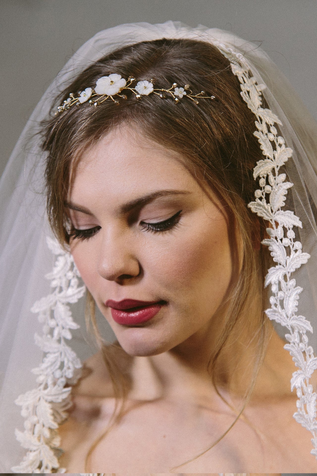 Rustic comb worn in tiara position with ivory flowers with gold crystals