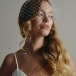 Slim ivory satin headband with attached Merry Widow veil