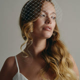 Slim ivory satin headband with attached Merry Widow veil