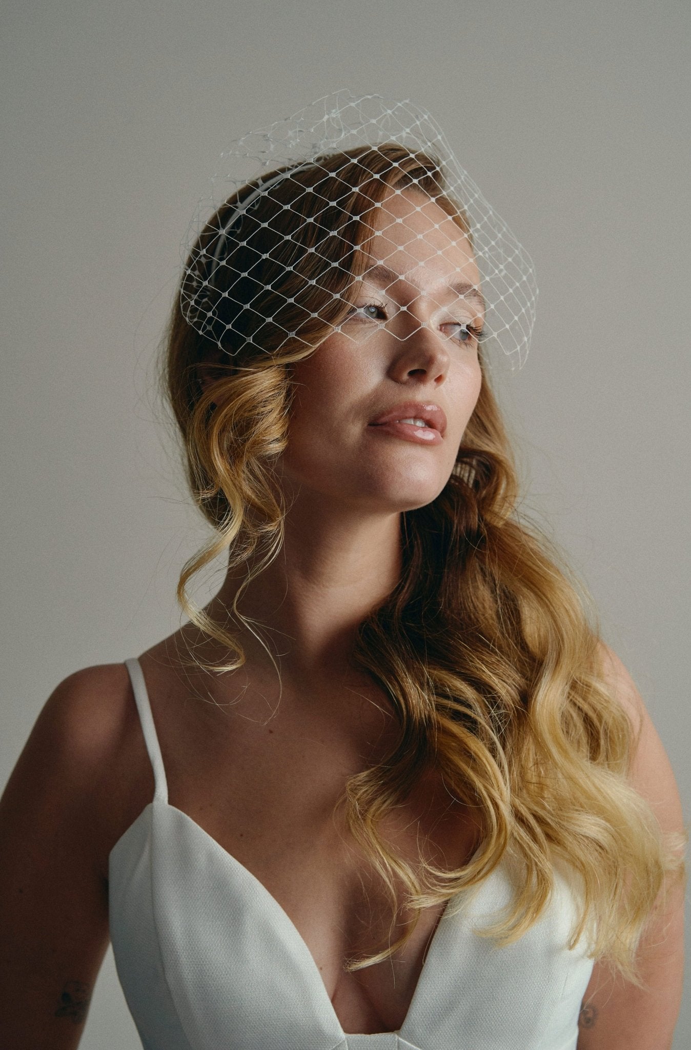 Slim ivory satin headband with attached Merry Widow veil