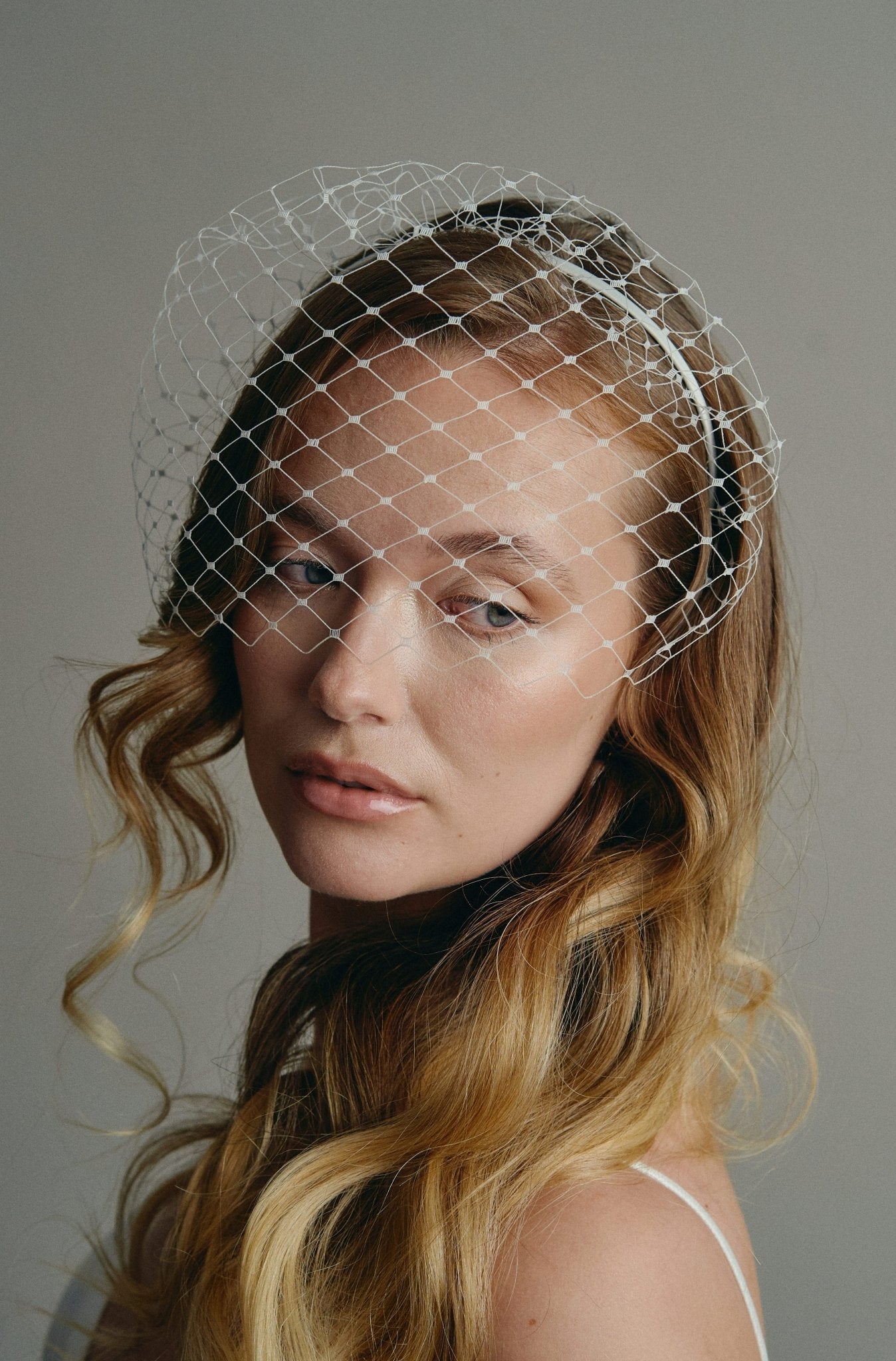 Slim ivory satin headband with attached Merry Widow veil