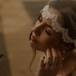 Bride wearing a lace edged tulle short micro veil in Juliet cap veil position