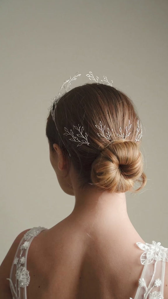 Model wears Amelia Silver Leaf Crown with matching leafy wedding hair pins in the back of her hair