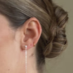bride wears long drop silver crytal and round pearl earrings