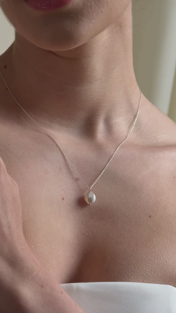 bride wears vegan coin pearl necklace