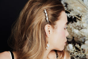 Swarovski star and pearl bridal hair comb worn to the side of the head