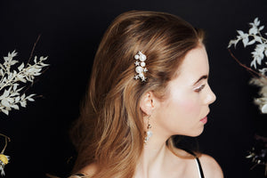 Gold Swarovski Crystal star and pearl cluster bridal hair comb worn to the side of the head