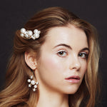 Celestial pearl and crystal star hair pins worn with matching bridal earrings