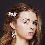 Celestial pearl and crystal star hair pins worn with matching bridal earrings