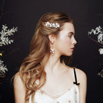 Celestial pearl and crystal star hair pins worn with matching wedding earrings