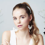 Flower hoop earrings and comb set for a boho bride worn with high pony tail