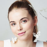 Chandelier mother of pearl flower wedding earrings worn with high ponytail
