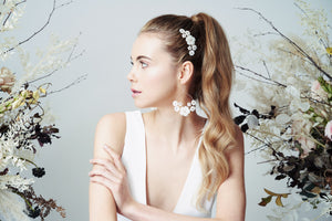 Mother of pearl statement chandelier bridal earrings and wedding hair comb set worn with high pony tail