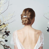 Beth mother of pearl flower classic wedding hair comb by Debbie Carlisle worn with up do