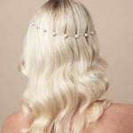 Simple pearl goldheadband pinned in back of the head - Pru