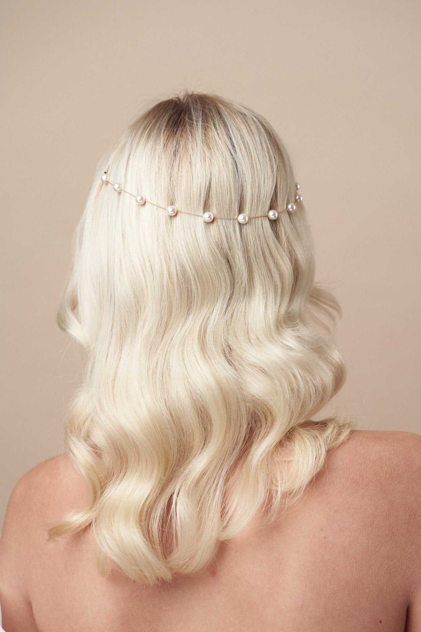 Simple pearl goldheadband pinned in back of the head - Pru