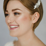 Short haired bride with pixie cut wears a vintage crystal wedding hair comb