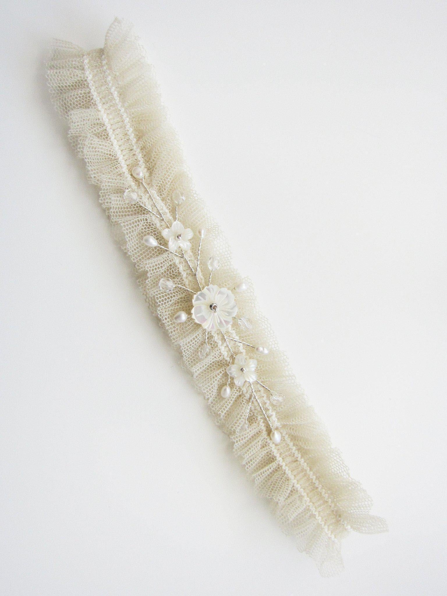 Enchanted freshwater pearl crystal and mother of pearl floral wedding garter