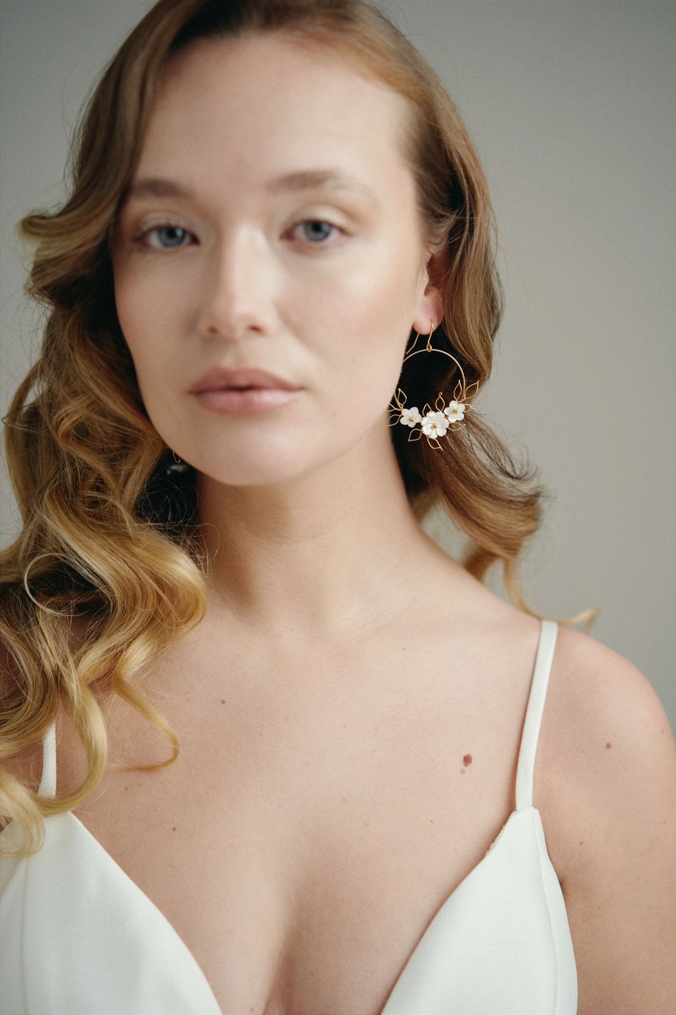 Flora silver gold hoop earrings with wire leaf detail