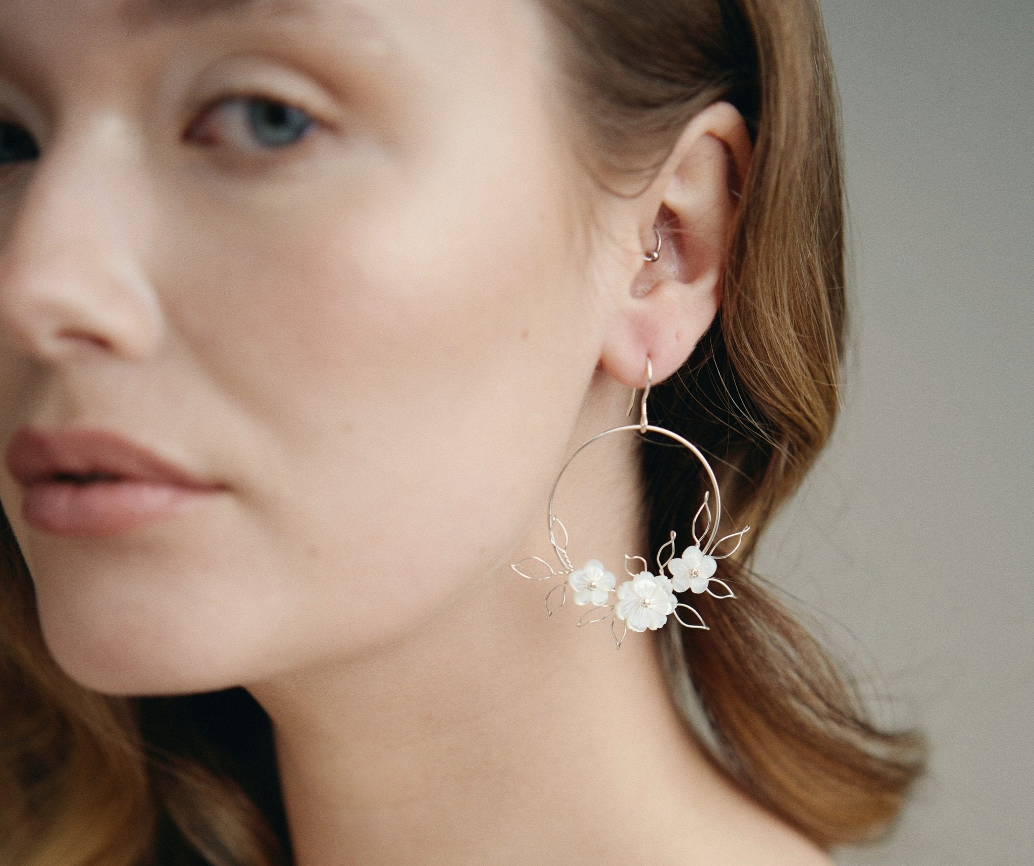 Flora silver flower hoop earrings with wire leaf detail