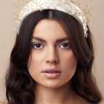 Embellished floral ivory padded headband worn with gold crystal crown