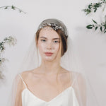 Delicate silver crystal wedding headband with Juliet cap veil