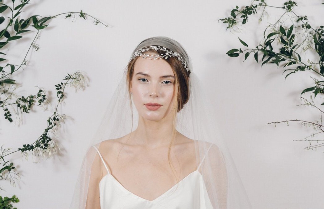 Delicate silver crystal wedding headband with Juliet cap veil
