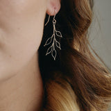 delicate silver wire leaf design earrings