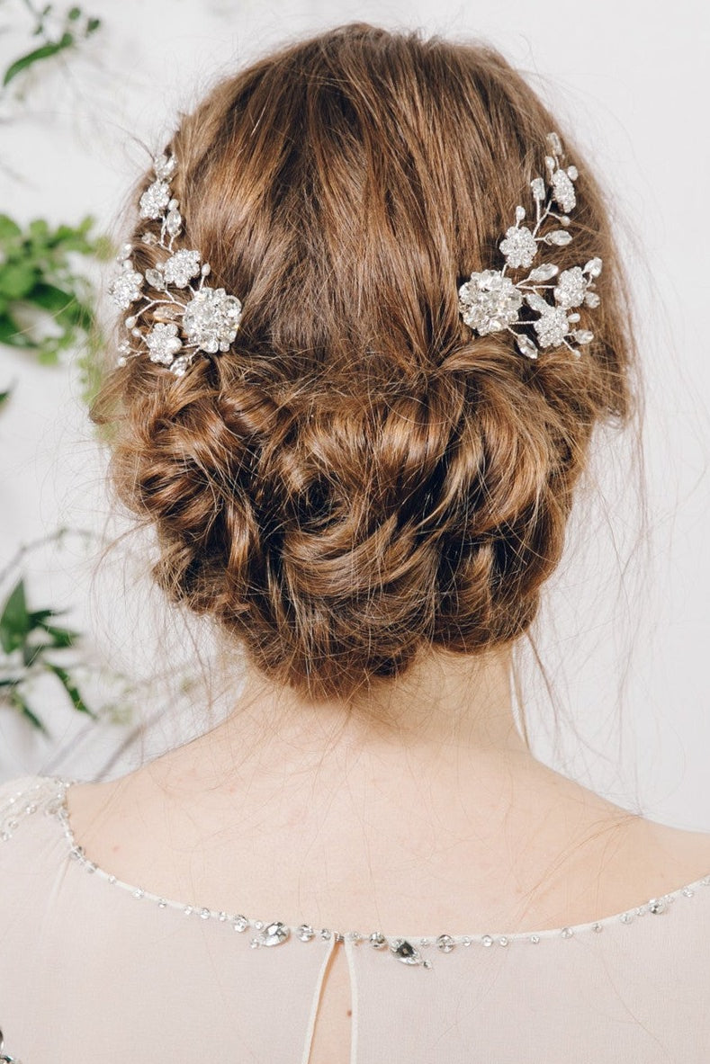 Mirror image pair of silver flower bridal hair combs