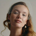 Eliza large baroque pearl hoop earrings with Raye birdcage veil headband