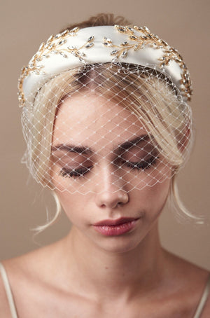 Gold and ivory padded headband with birdcage veil