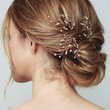 Gold blossom leaf cluster hairpins worn with chignon - Sophia