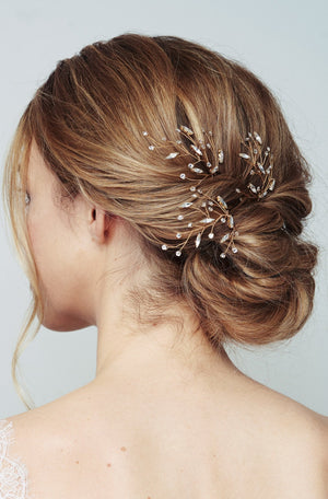 Gold blossom leaf cluster hairpins worn with chignon - Sophia
