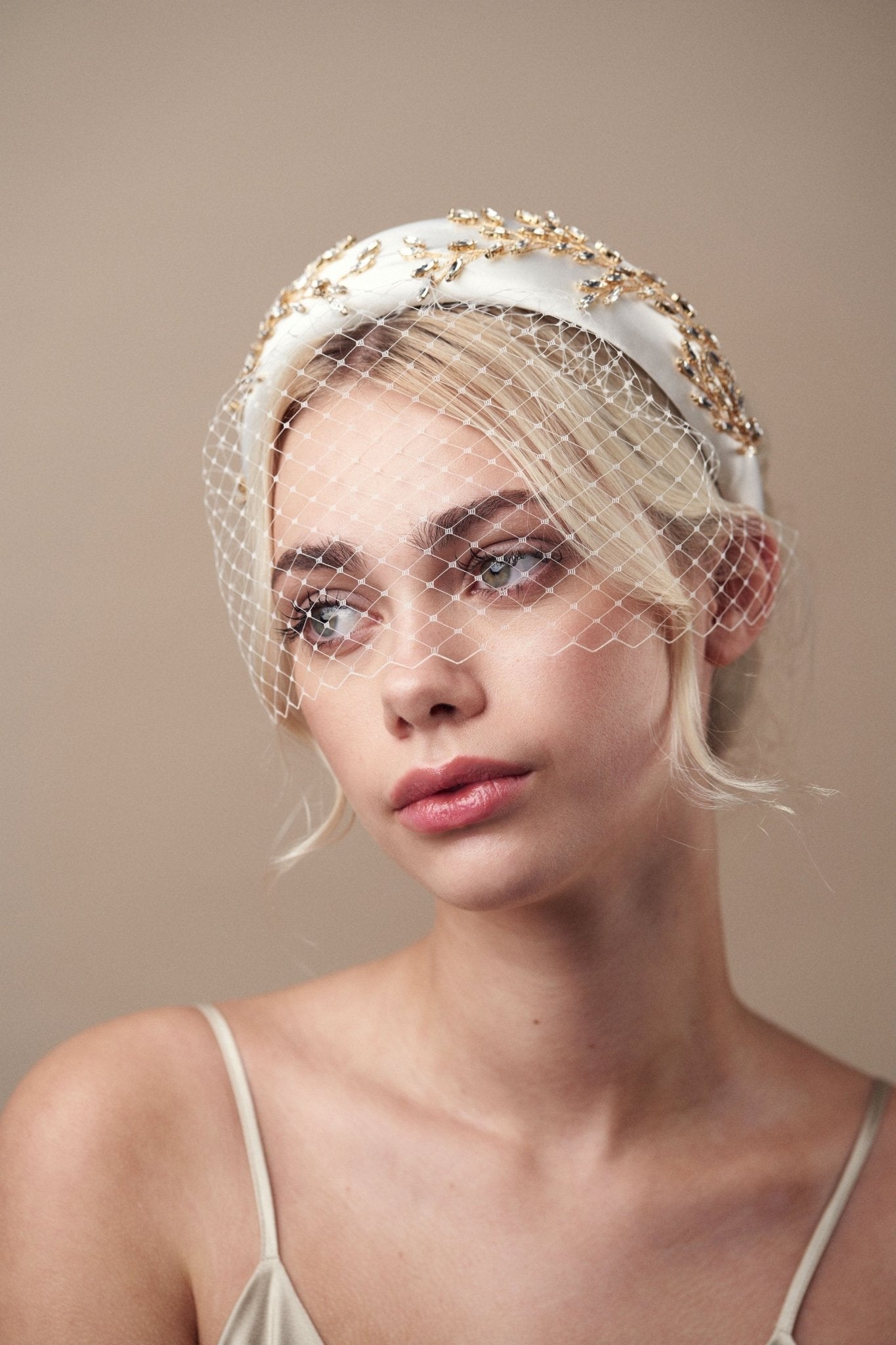 Short birdcage veil styled with Gold and Ivory  crystal padded headband