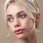 Gold and ivory padded headband with birdcage veil
