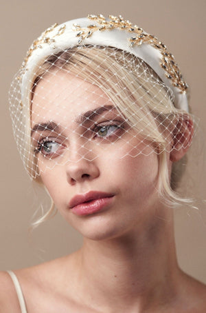 Gold and ivory padded headband with birdcage veil