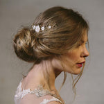 Rustic comb worn in side of the head with ivory flowers with gold crystals