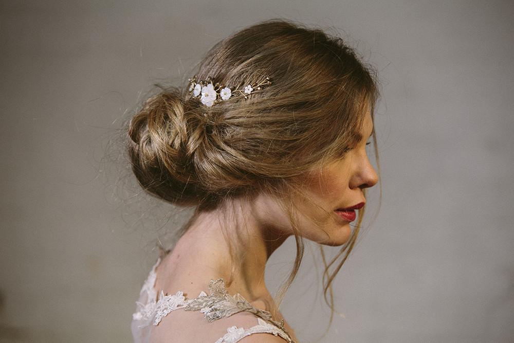 Rustic comb worn in side of the head with ivory flowers with gold crystals