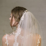 Rustic comb worn in above veil with ivory flowers with clear crystals and pearls