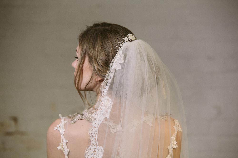 Rustic comb worn in above veil with ivory flowers with clear crystals and pearls